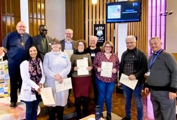 people holding certificates