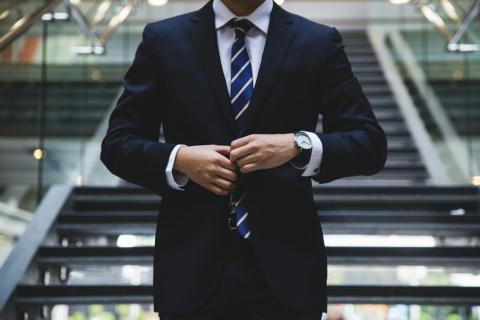 Photo of man in suit by Hunters Race on Unsplash